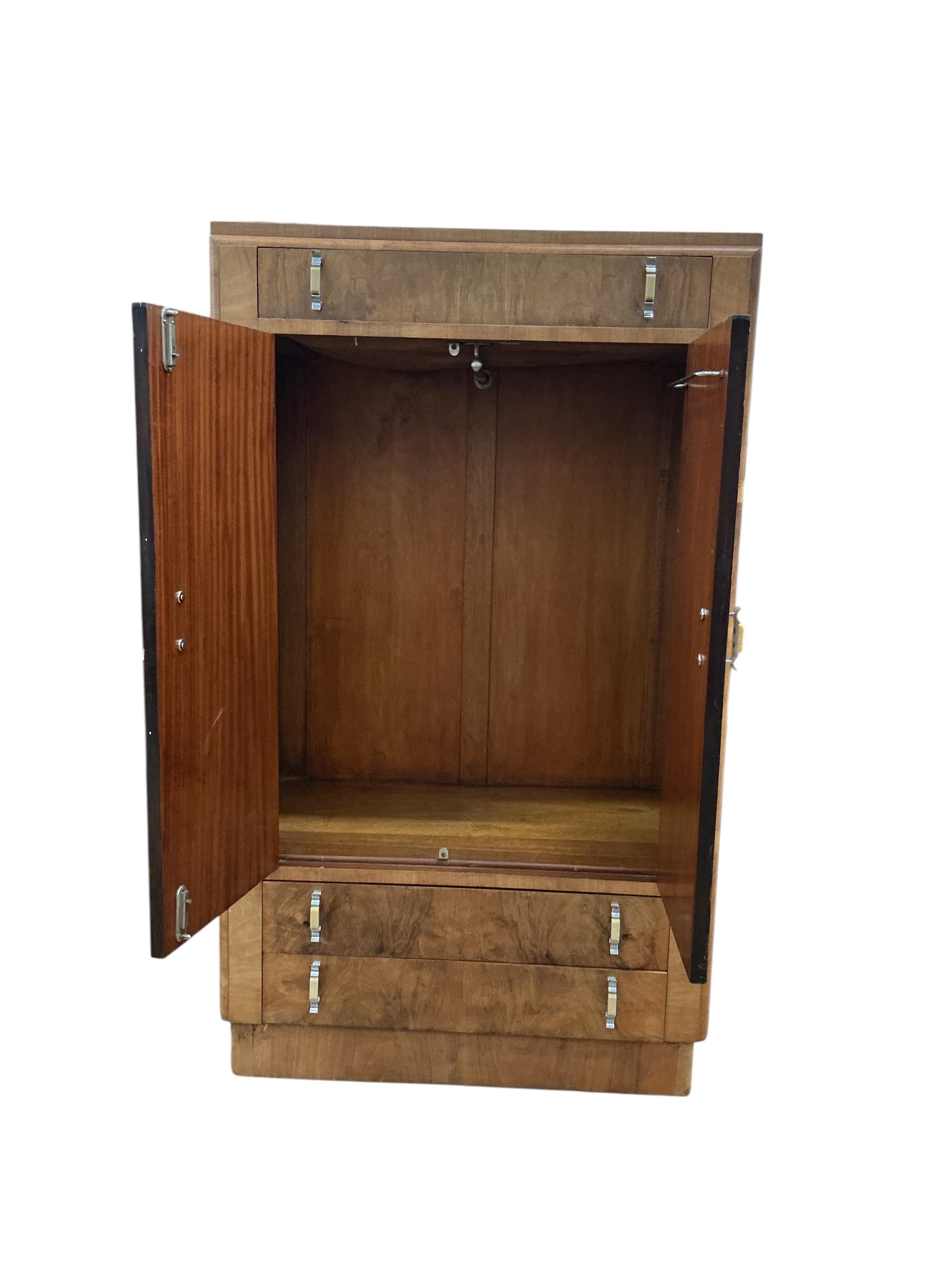 An Art Deco walnut gentleman's wardrobe, width 83cm, depth 49cm, height 140cm